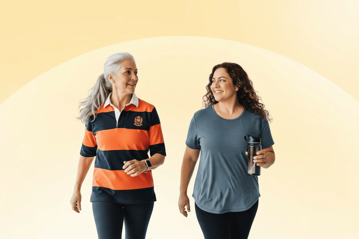 Two women walking and smiling, dressed in casual athletic wear, against a soft yellow gradient background. One holds a water bottle.