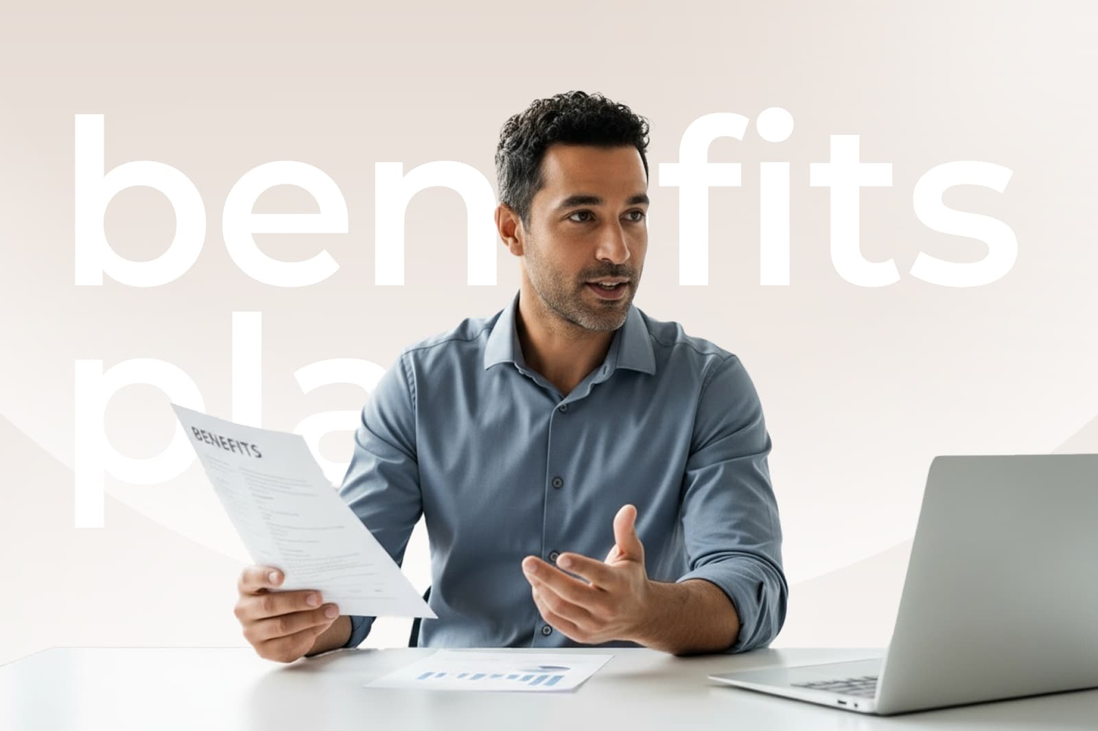 Man in a blue shirt holding a document, discussing at a desk with a laptop. Background text reads "benefits plan."