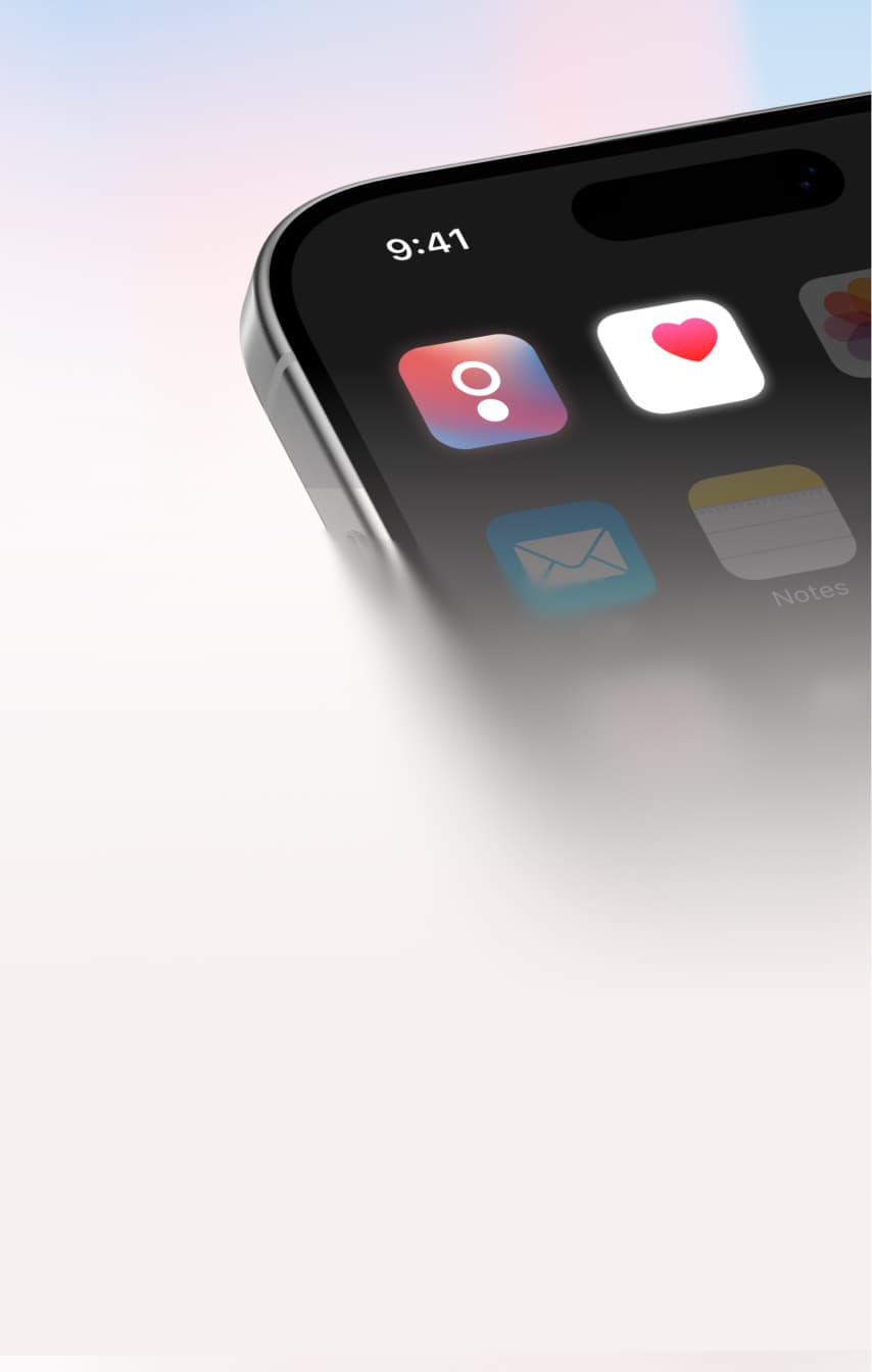 A close-up of a smartphone screen showing app icons, including a health app with a heart symbol, a mail app, and a notes app, with a blurred light background. The phone displays the time as 9:41.