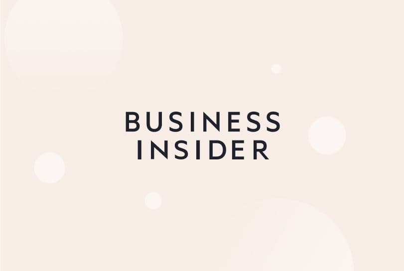 Business Insider logo on cream background